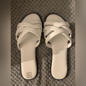 Women’s white sandal. Size 40 in European and a size 9 for USA. Brand new in box